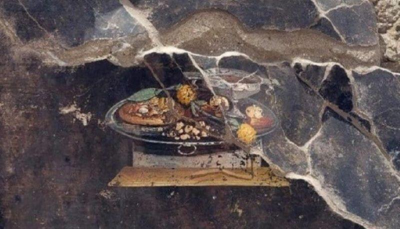 In un affresco di Pompei l’antenato della pizza